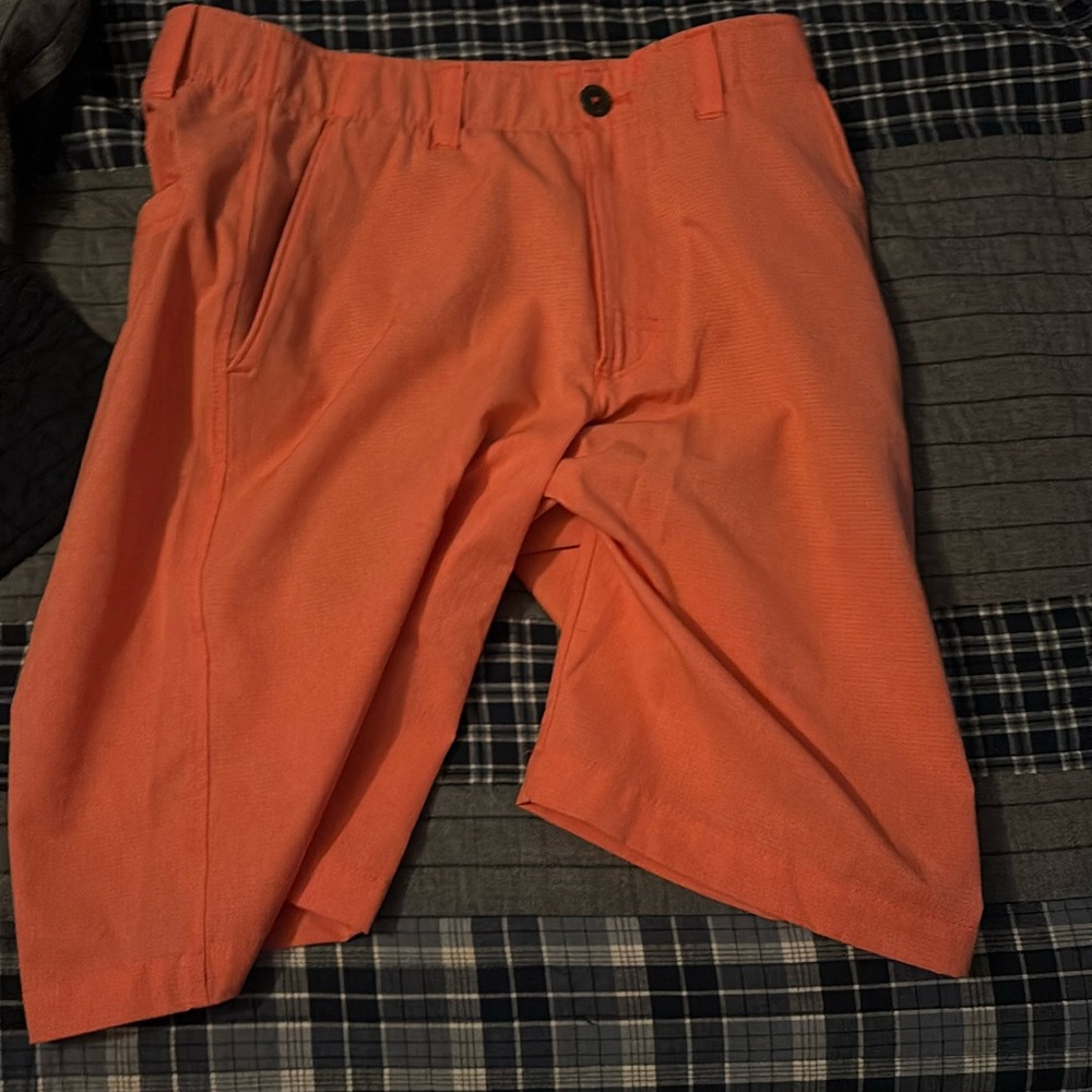 These pink Under Armour golf shorts, with a waist size of 30.